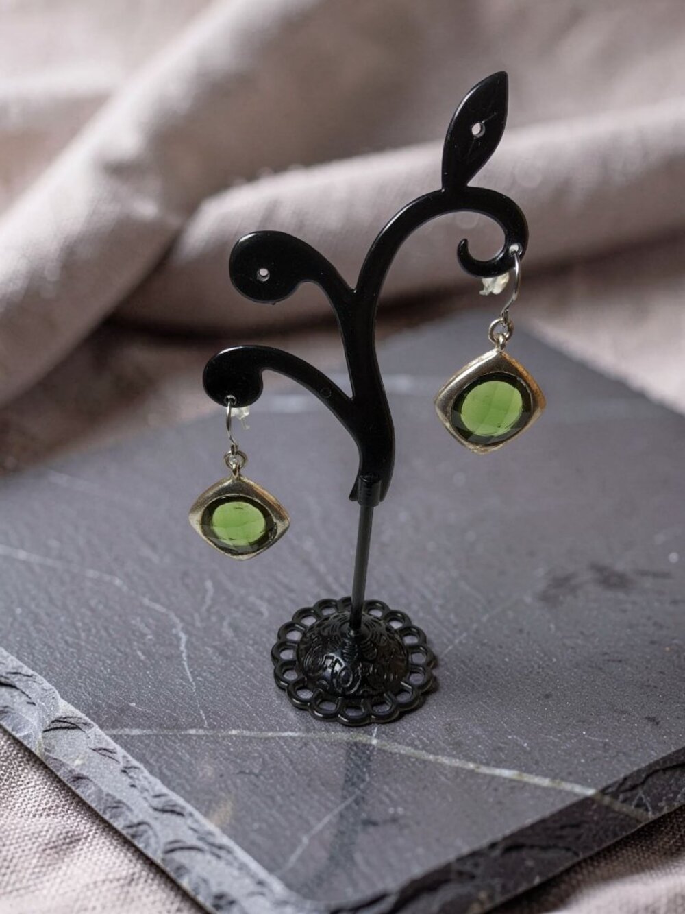 vintage pair of translucent green acrylic dangle diamond shaped earrings.